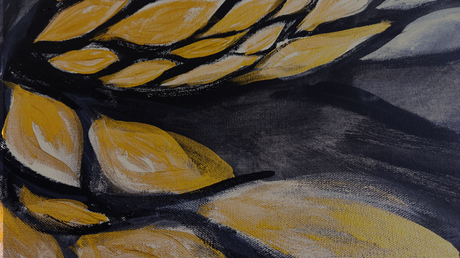 A close up of “Metamorphosis”, the image shows the golden eye shapes that form the butterfly shape in the painting against the black background