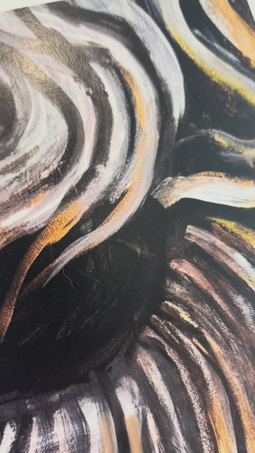 an up close video view of illusions, showing off the eye with all of the swirls in and around it, panning to the nose with septum piercing and lips 