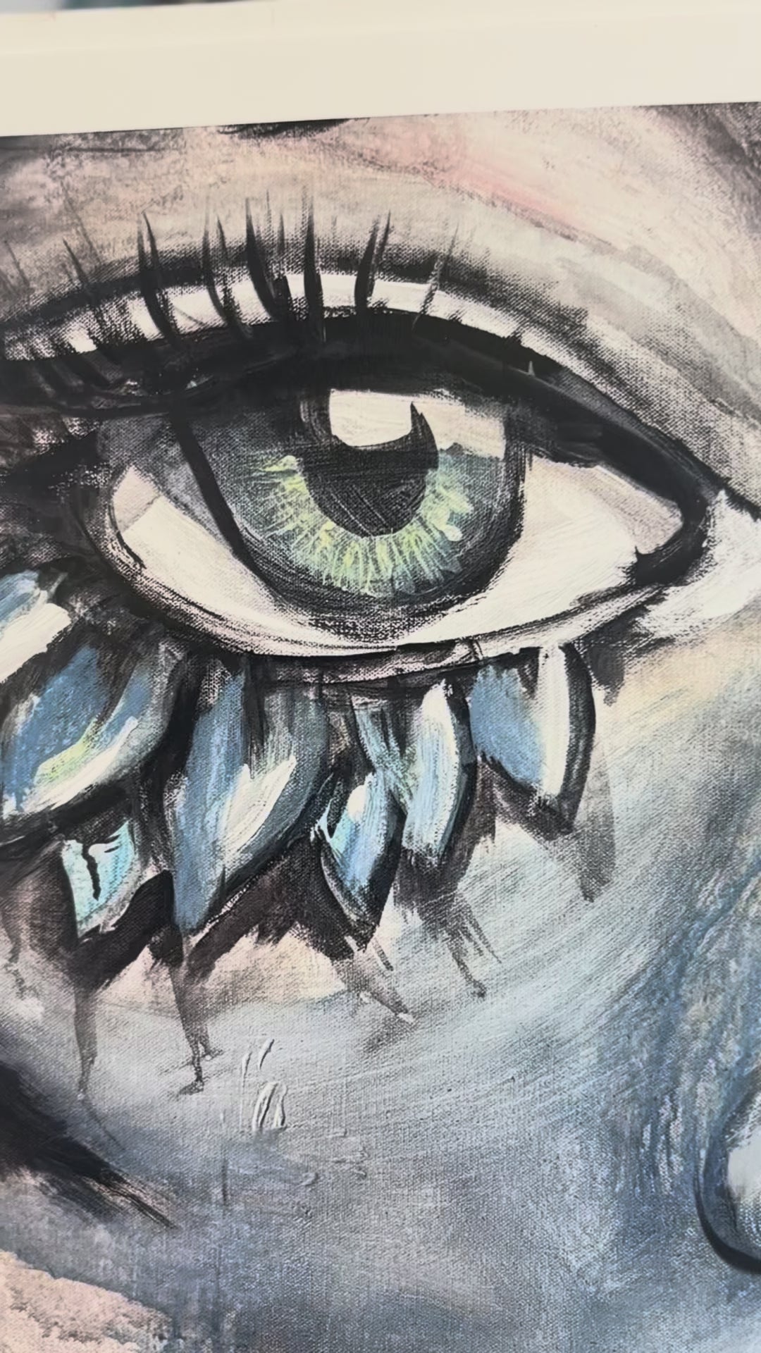 A closeup view of the painig “flourish”. the view starts with a blue eye with blue flower petals blooming around the outer corner of the eye with wispy eyelashes, panning down to the lips of the face, which have a painted glossy effect. 

Flourish symbolizes the act of flourishing through life despite vision loss. 